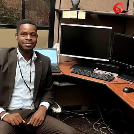 2023 ISPP Scholar Oluwaseun Ojo at his desk at the Illinois Department of Ag