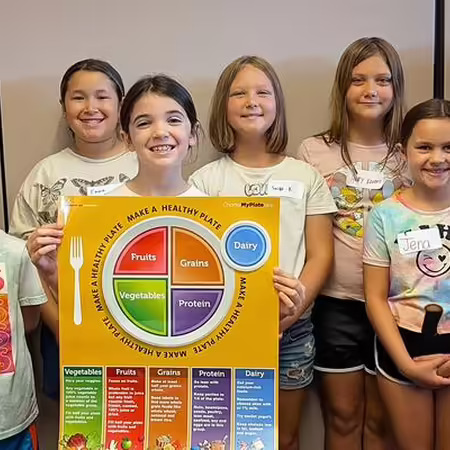 Elementary children posing together as a group
