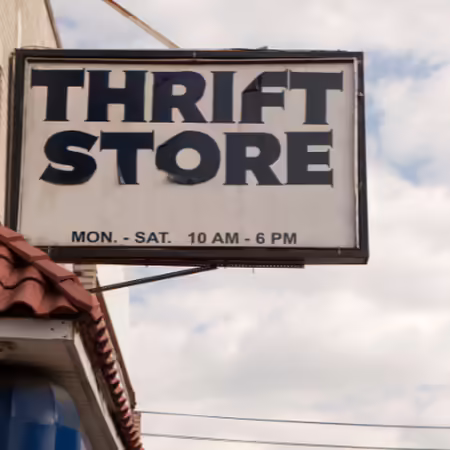 Store front with sign reading "Thrift Store"