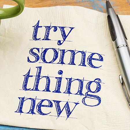 a paper that says "try something new" 