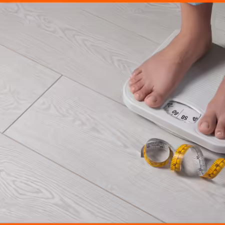 A person weighing himself on a scale with a tape measure on his feet.