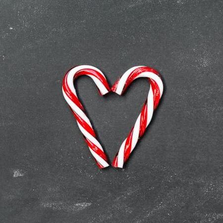 Two candy canes making a heart