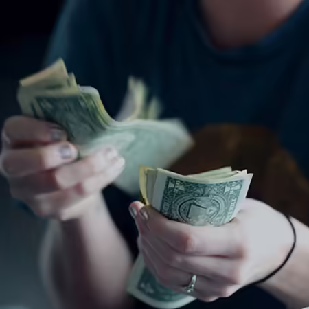 someone counting dollars 