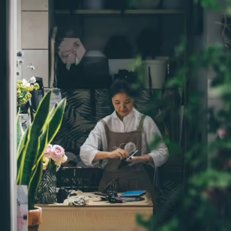 female owner working in floral shop