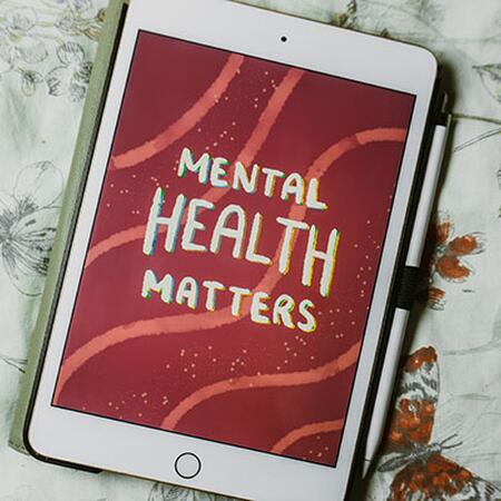 iPad device showing the words "Mental Health Matters" 