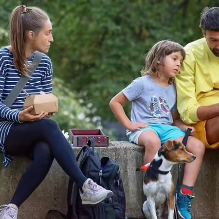 Parents with child looking at phone