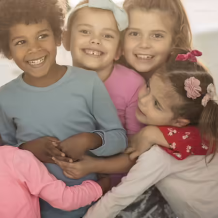 kids smiling and hugging