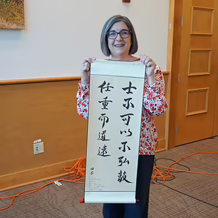 ISPP Director Evangeline Pianfetti with Scroll