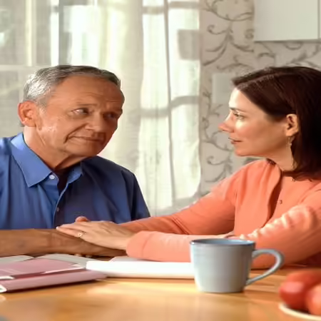 man and woman sitting at table
