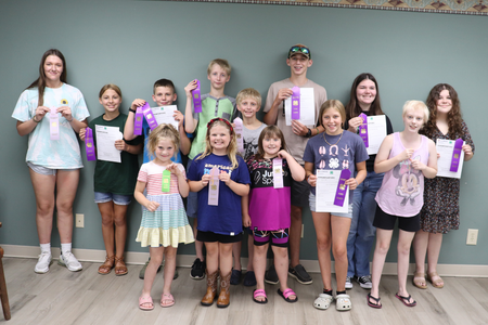 4-H youth showcase their ribbons from the 4-H foods show.