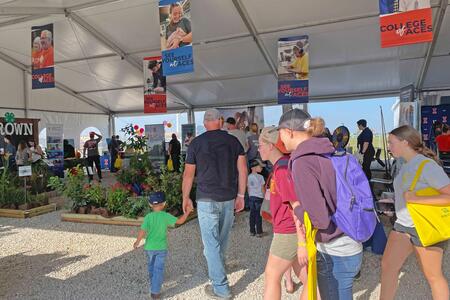 Farm Progress Show attendees visit the College of ACES / Illinois Extension tent