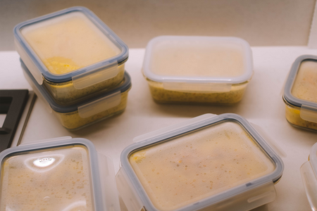 Tupperware containers with food in them