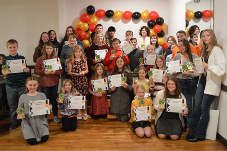 Winners of the Outstanding Recordbook Award pose with their certificates in a large group.