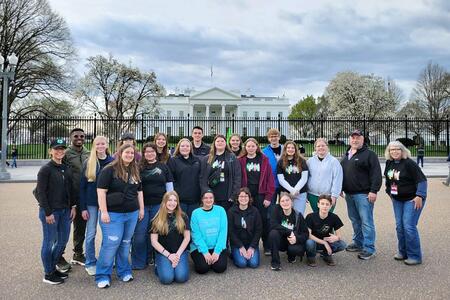 group of teens standing in front of White House in Washington DC