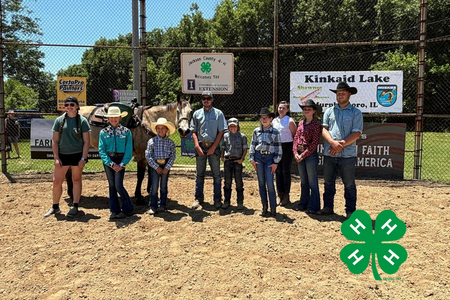 A group of 4-H youth hold up that recently placed in the horse show.