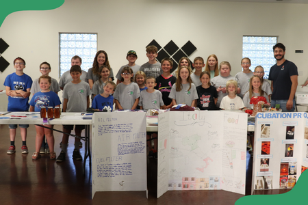 A group of 4-H youth gather with their projects at the general show.