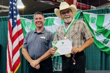 Two men with certificate