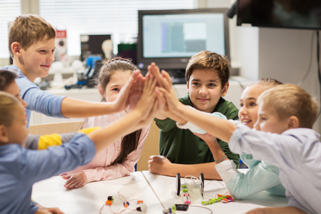 youth giving each other the high five