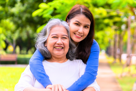 daughter with her arms around her grandmother