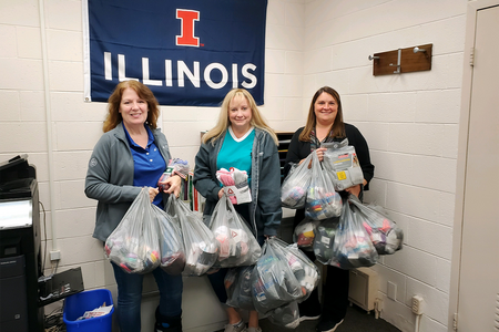 Three women with bags in their hands