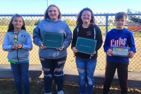 4- H members holding their awards