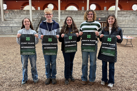 Senior winners pose with banners.