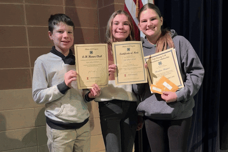 Three youth holding certificates and smiling.