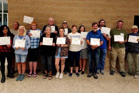 Master Naturalist volunteers pose with diplomas