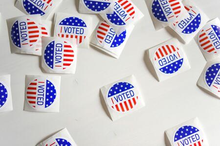 "I voted" stickers arranged on a table