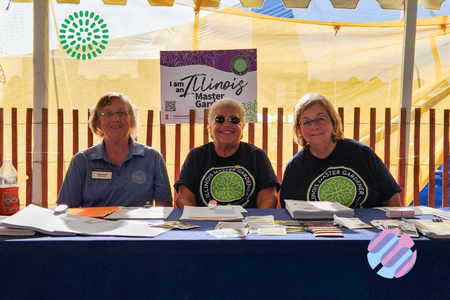Master gardeners sit at a table