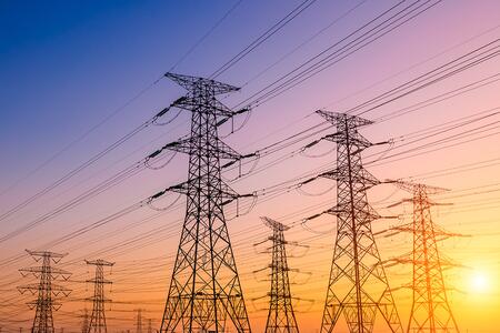 Sun rise with electrical towers in front
