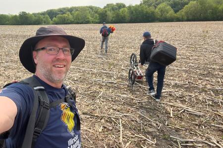 Master Naturalist Chris Woeltje with archaeologists in farm field