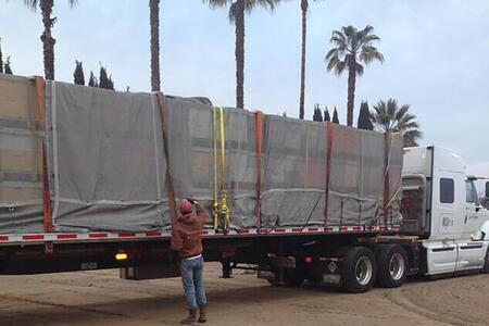 a man checks a semi truck load
