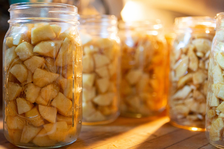 Jars of apples on a table