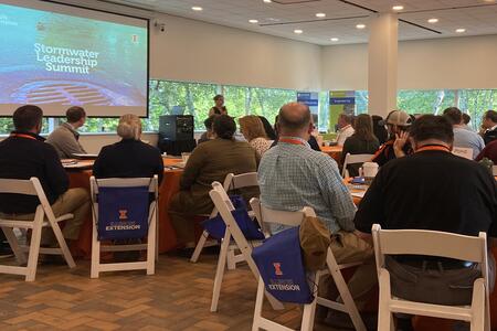 attendees listen to speaker at stormwater conference