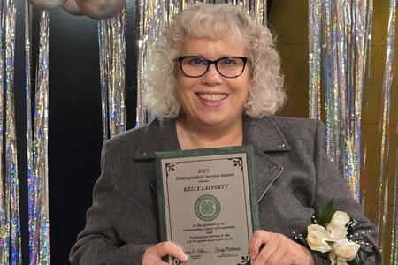 Kelly Lafferty with award