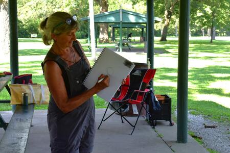 Participant demonstrating nature journaling ideas at the park outdoors 