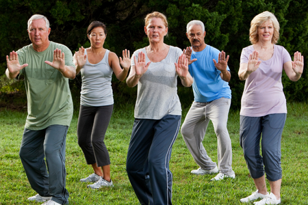 Group of older adults practicing tai chi