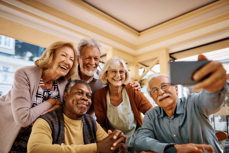 Group of older people taking a selfie