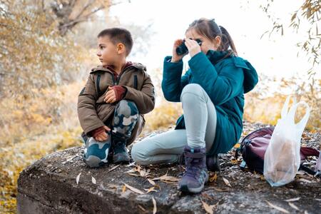 A boy and girl exploring nature 