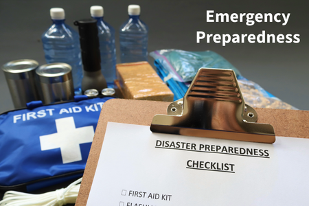 bottled water, canned food, flashlight and first aid kit