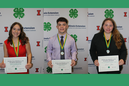 Winning scholarship youth pose with a certificate.