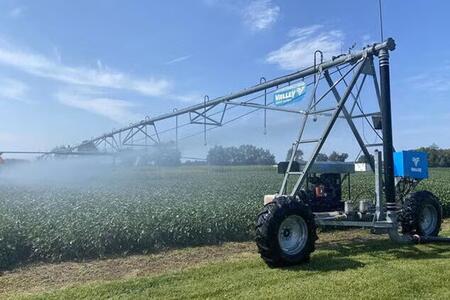 A crop field irrigation system releasing water over experimental plots at the Kellogg Biological Station, Michigan. 