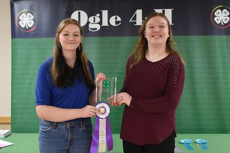 Two youth holding a ribbon
