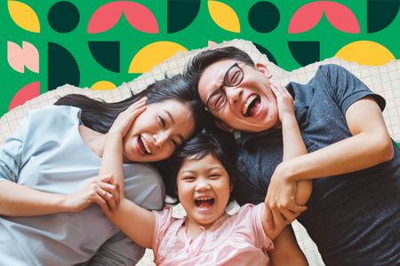 A family smile at the camera