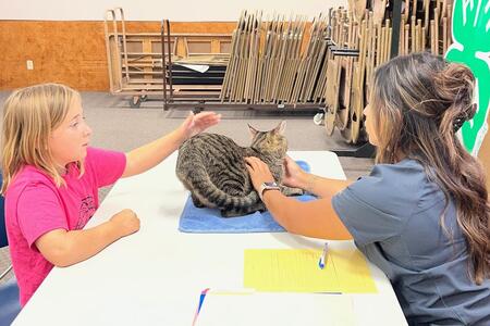 a girl showing her cat