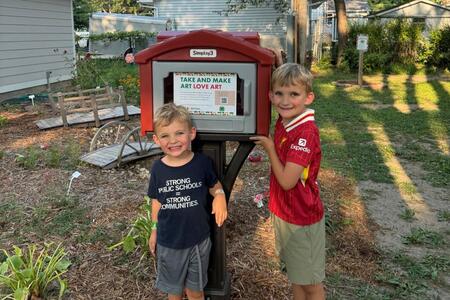 two children with little art library