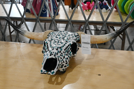 A glass decorated cow skull created by a 4-H'er