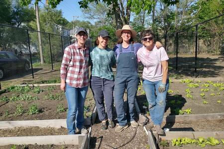four ladies in a garden