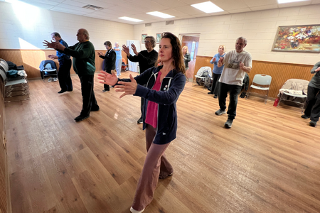 Food and Nutrition Educator Kristin Bogdonas leading a class of tai chi for older adults 